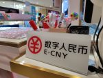 An E-CNY payment sign is put up on a desk in a store in the Luohu District in Shenzhen, Guangdong, 11 October 2020 (Photo: Reuters/Oriental Image).