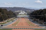 Australia's Parliament House (top) is visible above the old Parliament House (white building below) and Anzac Parade (foreground) in Canberra, 11 September 2012 (Photo: Reuters/Tim Wimborne)