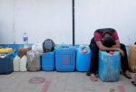 A man rests while waiting in a line to buy diesel near a Ceylon Petroleum Corporation fuel station, amid the country's economic crisis in Colombo, Sri Lanka, 7 April 2022 (Photo: Reuters/Dinuka Liyanawatte).