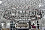 A worker operates a knitting machine at a textile factory of Texport Industries in Hindupur town in the southern state of Andhra Pradesh, India, 9 February 2022 (Photo: Reuters/Samuel Rajkumar).