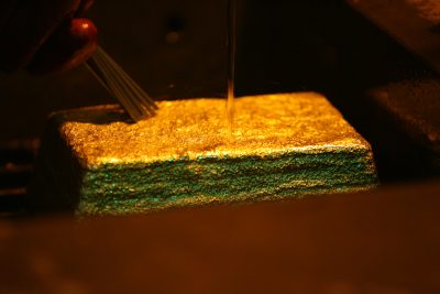 A freshly produced gold bar is cleaned at the Boroo Gold Mine in Boroo.  (Photo: Reuters/Nir Elias)