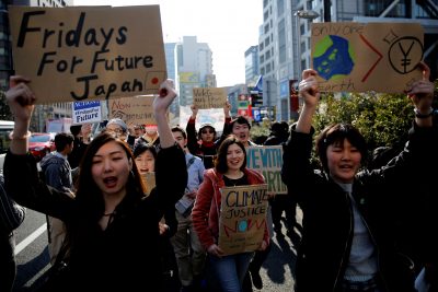 Schoolchildren march with placards during the Global Student Strike to take action against climate change in Tokyo, Japan, March 15, 2019 (Photo: Reuters/Kim Kyung-hoon).