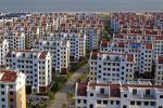 View of empty newly-constructed residential apartment buildings in Rushan city, China, 26 September 2013 (Photo: Reuters/Oriental Image)
