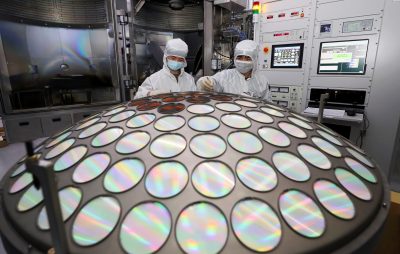 Employees work on the semiconductor chip production line of Jiangsu Azure Corp in Huaian, Jiangsu province, China, 25 March 2022 (Photo: Reuters/China Daily).
