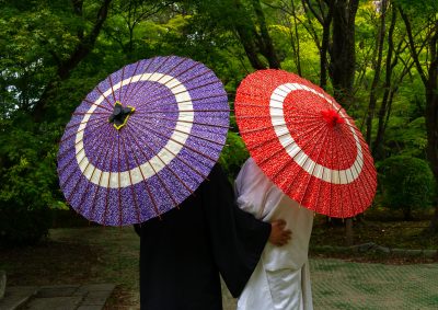 Japanese couple with umbrellas in the botanic garden, Kansai region, Kyoto, Japan. (Photo: Reuters)