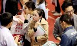 Chinese graduates look for employment during a job fair at the campus of Shandong University in Ji'nan city, Shandong province, China, 31 March 2018. (Photo: Reuters/Zhao Xiaoming)