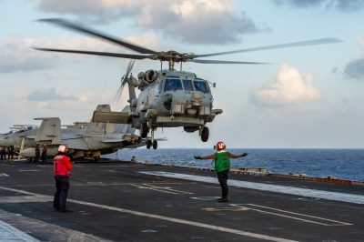 Handout photo dated January 11, 2023 shows An MH-60R Sea Hawk helicopter from the 'Battlecats' of Helicopter Maritime Strike Squadron (HSM) 73 lands on the aircraft carrier USS Nimitz (CVN 68) in the Philippine Sea. A US carrier strike group began operating in the South China Sea on Thursday, the Navy announced, amid heightened tensions with Beijing, which claims much of the body of water as its sovereign territory (Photo: Reuters/ABACA Press)