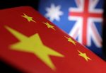 Printed Chinese and Australian flags (Photo: Reuters/Dado Ruvic)