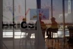 South African delegates sit behind a glass with BRICS logo as the BRICS summit is held in Johannesburg, South Africa, 23 August 2023 (Photo: Reuters/Alet Pretorius).
