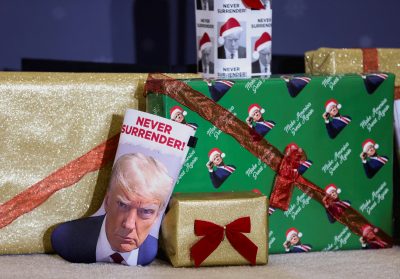 A Christmas boot and gifts featuring the image of Republican presidential candidate and former US President Donald Trump are displayed ahead of Trump's campaign event in Waterloo, Iowa, US, 19 December 2023 (Photo: Reuters/Scott Morgan).